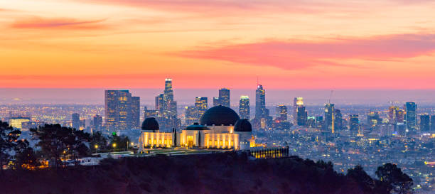 Los Angeles Skyline at Dawn Panorama and Griffith Park Observatory in the Foreground Los Angeles skyline at dawn with Griffith Park Observatory in the foreground los angeles aerial stock pictures, royalty-free photos & images