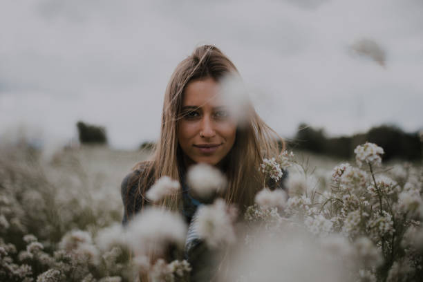 istock Young woman at flower field 946239742