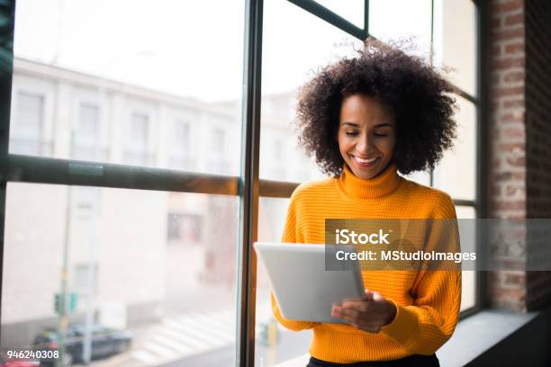 Smiling Woman Using Digital Tablet Stock Photo - Download Image Now - Digital Tablet, Women, One Woman Only
