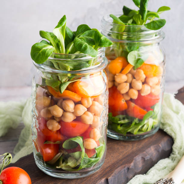 istock Fresh salad lunch served in mason jars 946240416