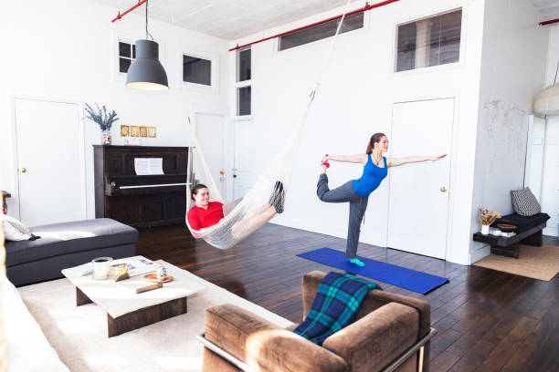istock Boyfriend working as the girlfriend exercises. 946242962
