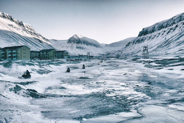 Icy and snovy landscape , Longyearbyen, Svalbard and Jan Mayen Islands. Snow scooters is a very convenient way to get around in these cold parts of the world.
