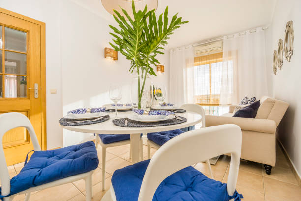 istock Living room with a dining table in modern, luxury, bright apartment 946247504