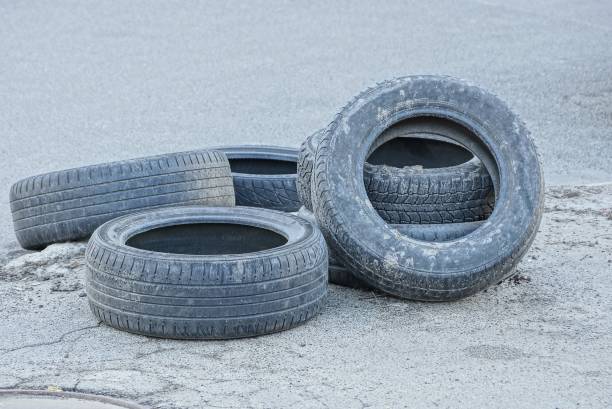 istock old rubber tires on gray asphalt in a pile 946247518