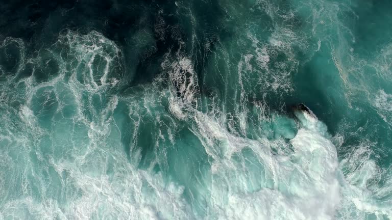 Real time shot of sea surf. Aerial top down view