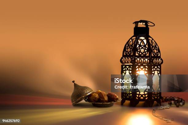 Lantern Prayer Beads Beads And Date Fruits With Color Reflection On Background Stock Photo - Download Image Now