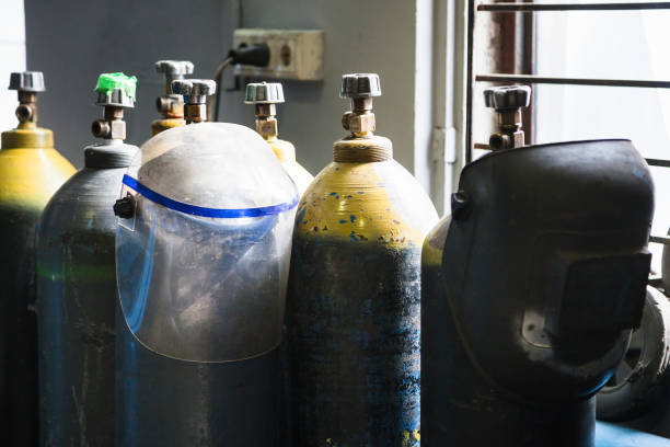 istock gas cylinders and protection mask in workshop 946260908