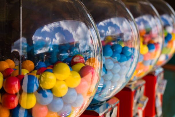 A couple of gumball machines in a row A couple of  gumball machines in a row gumball machine stock pictures, royalty-free photos & images