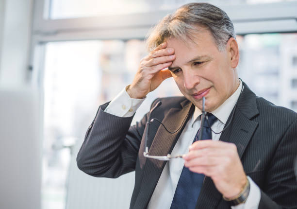 istock Mature businessman having a headache. 946268616