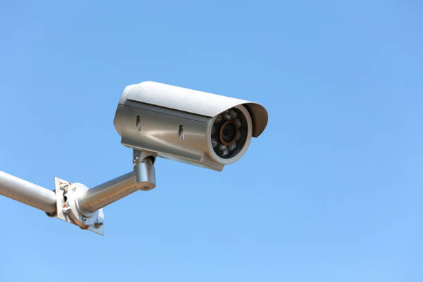 istock Low Angle View Of Security Camera Against Clear Blue Sky 946274148