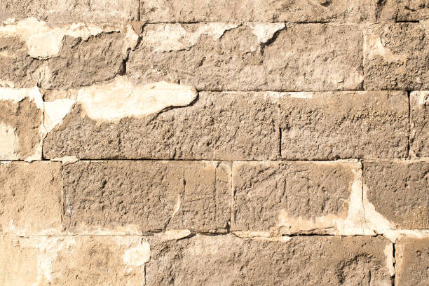 istock old half-ruined brick wall with cracks 946280234