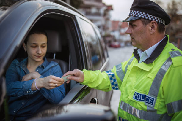 istock Woman pulled over by police officer 946283266