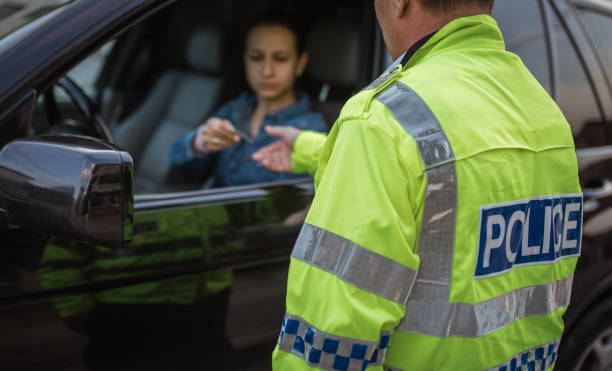 istock Young woman pulled over by police officer 946283756