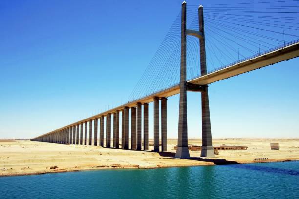 istock Low Angle View Of Suez Canal Bridge Against Blue Sky 946294484