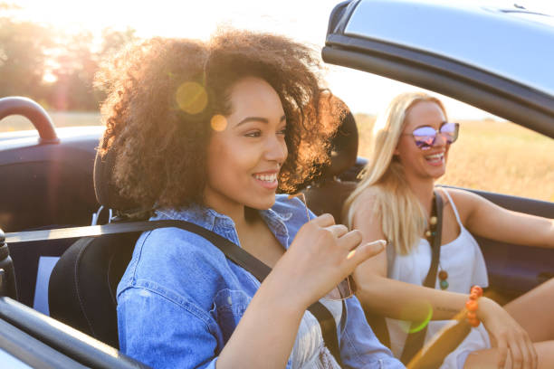 istock Girlfriends having fun on road trip 946298418