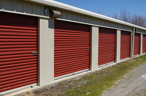 Row of self storage units with overhead style doors.