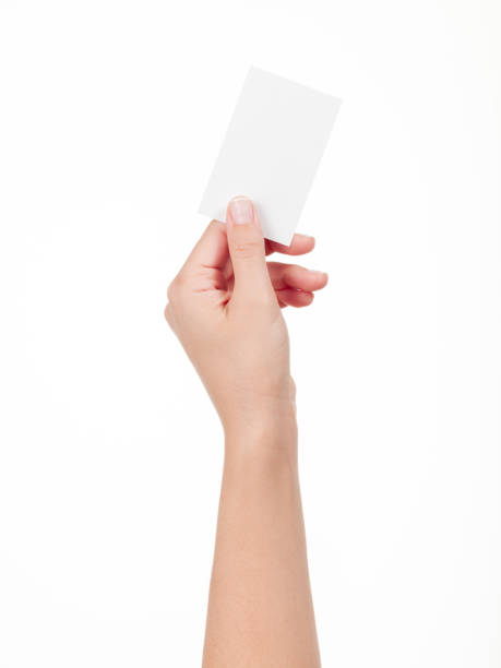 istock Woman Hand holding an empty business card 946305474