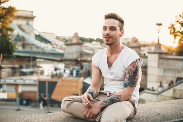 istock Handsome young man with tattoos 946305920