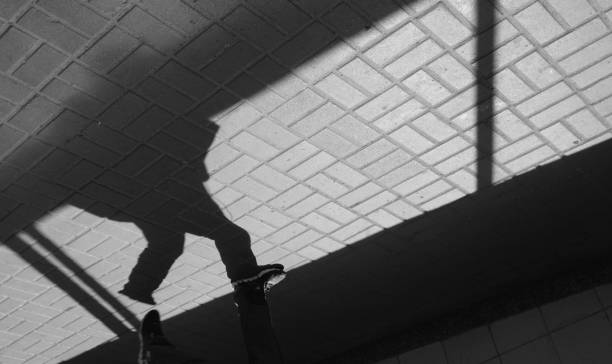 istock Silhouette person in an underground passage 946322538
