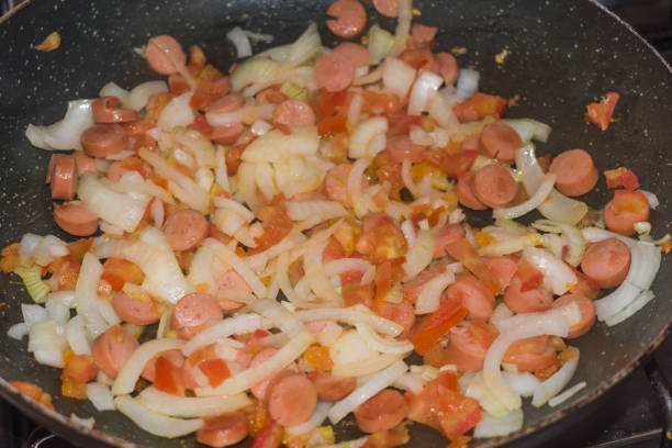 istock STEW OF TOMATO ONION AND SAUSAGE 946326846