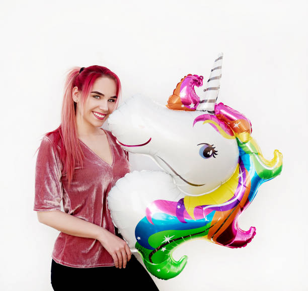 istock Young woman with balloon 946327462