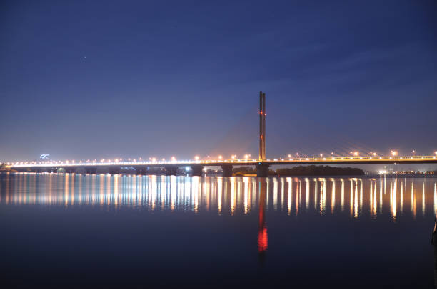 istock Long bridge in the night city. 946328104