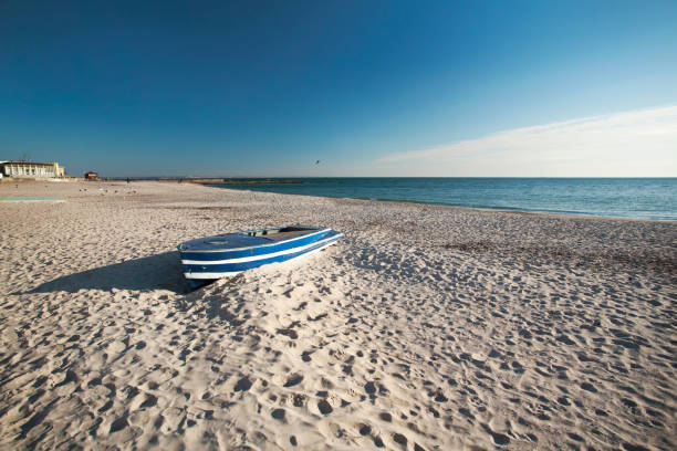 istock Empty beach. Boat on the shore of the ocean. 946328160