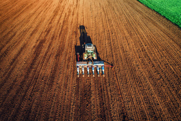 istock Farmer in tractor preparing farmland with seedbed for the next year 946328422