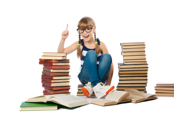 istock intelligent girl reads a book on a white background 946328524