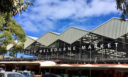 Melbourne, Australia: April 06, 2018: Street view of South Melbourne Market which opened in 1867. The multifaceted rooftop car park captures rainwater and generates solar energy.