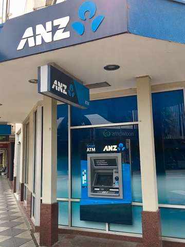 Melbourne, Australia: April 10, 2018: Street view of a Bank of Australia and New Zealand (ANZ) branch in the suburb of St Kilda with two ATM machines available.