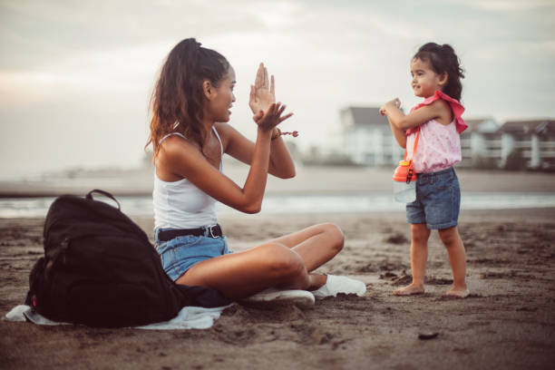 istock Girls having fun on the beach 946334220