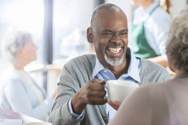 istock Handsome senior man enjoys coffee with his wife 946334546