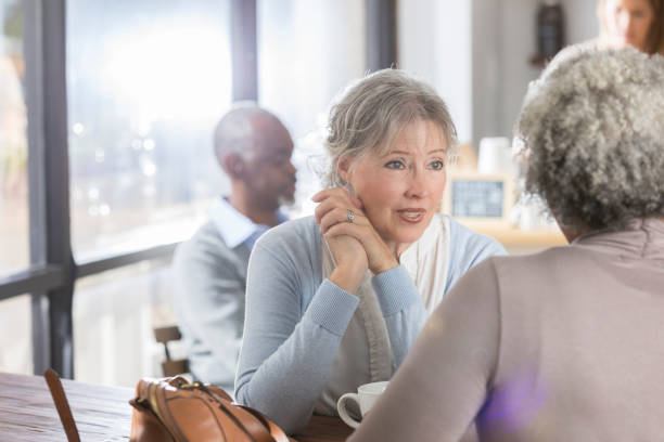 istock Senior woman has serious conversation with friend 946334568