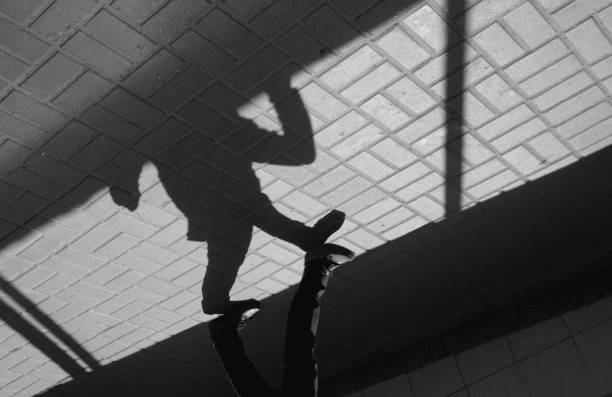 istock Silhouette person in an underground passage 946335250
