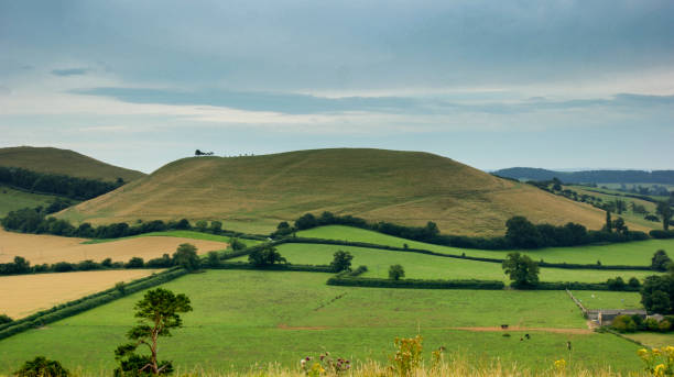 istock View of green meadows from Camelot 946335514