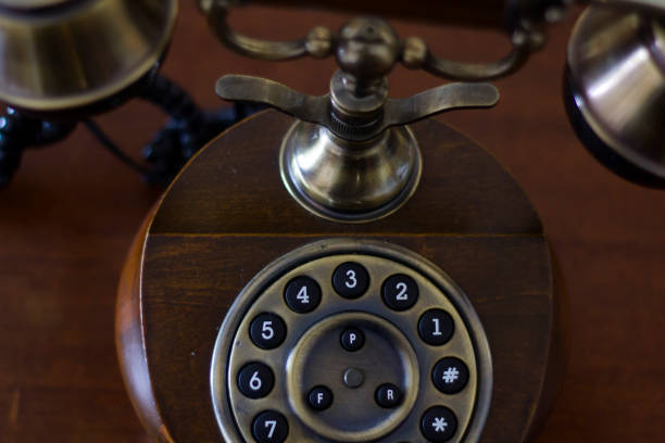 istock Vintage phone on wooden table. Top View 946344944