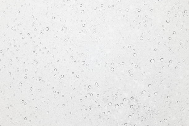 istock Water drops on glass, Rain droplets on glass background. 946366282