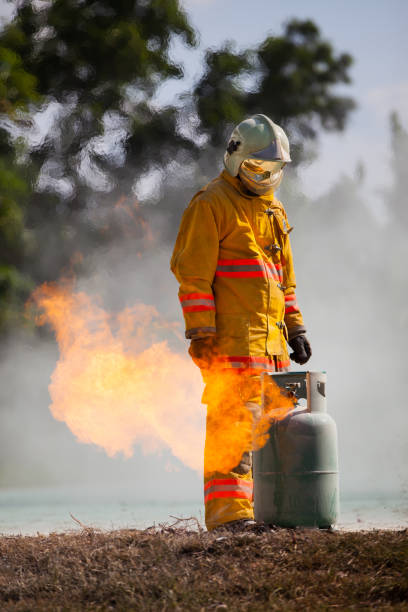 istock Firefighter with fire and suit for protect fire fighter for training firefighters. 946373760