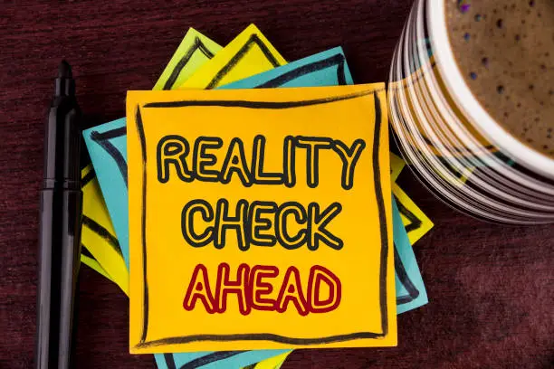 Writing note showing  Reality Check Ahead. Business photo showcasing Unveil truth knowing actuality avoid being sceptical written Sticky Note paper Wooden background Coffee Cup and Marker