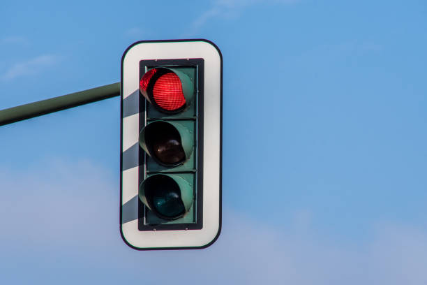 istock Low Angle View Of Traffic Signal Against Blue Sky 946388946
