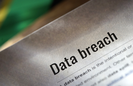 shot of paper with definition of data breach words