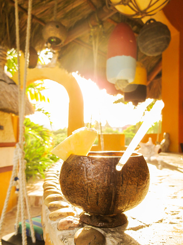 Time to relax at the end of a busy beach day with a tropical pina colada.
