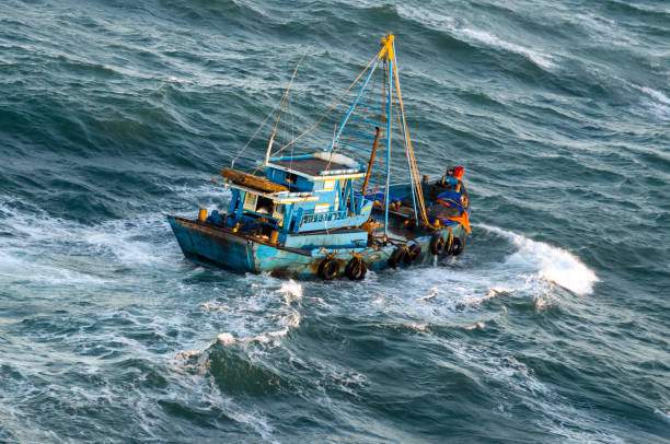 istock Fishing boat in a stormy sea 946411166