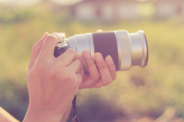 istock Woman with retro camera 946419722