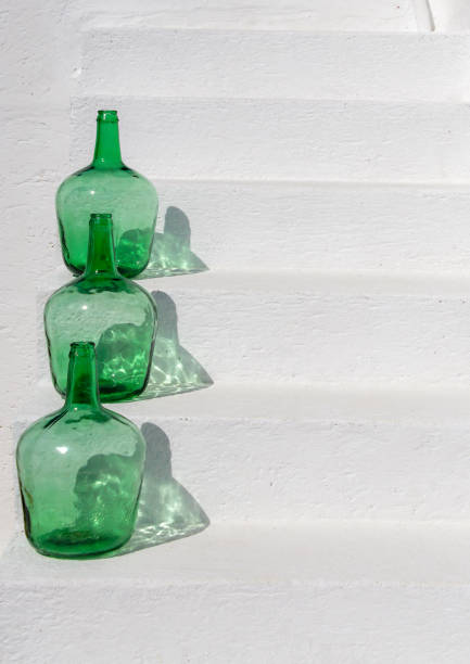A close-up shot of a collection of recyclable glass bottles.