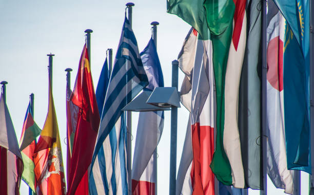 istock Close-Up Of Flags Hanging Against Sky 946420258