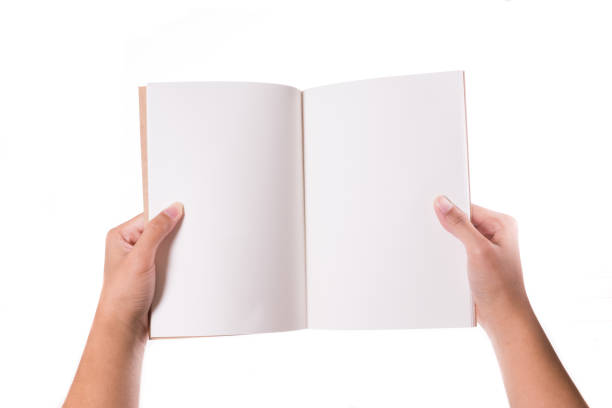istock Male hands holding book isolated on white 946426218