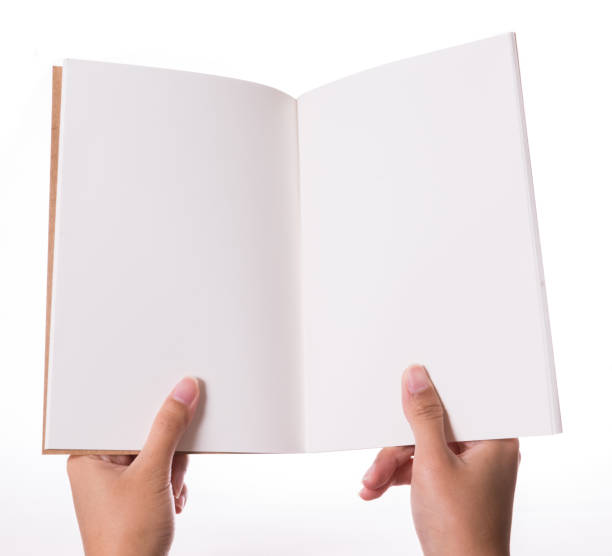 istock Male hands holding book isolated on white 946426302