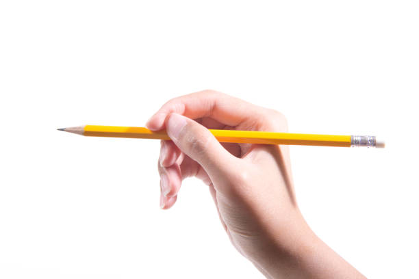 istock Hand holding pencil isolated on white background 946429874